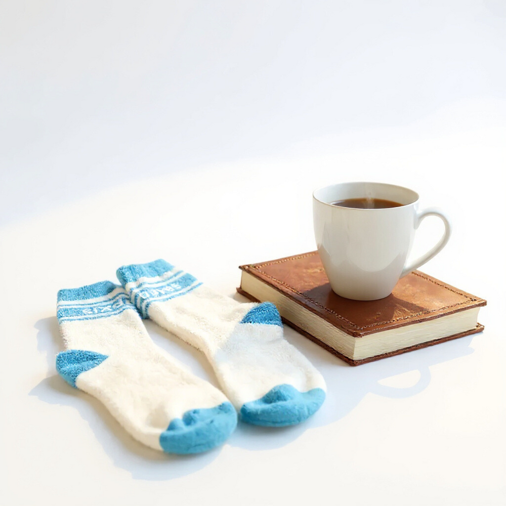 Gifts for cancer patients including fuzzy socks to provide comfort during cancer treatment. 